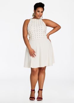 The plus-size Gold Studded Top Sleeveless Dress from Ashley Stewart. Glam it up with my plus size skater dress that comes sleeveless and sexy! This easy-to-wear, knee-length, fit-and-flare dress will accentuate your gorgeous curves and have you feeling ready to party, especially with my gold studded design on top that's cool, sleek, and undeniably stylish. Available from www.ashleystewart.com for $32.25