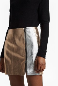 The Audrey Faux Leather Mini Skirt from French Connections is a statement alternative to your loyal leather skirt. Crafted in two-tone metallic faux leather, this design has an exposed side zip and mini length. Your ultimate day to night skirt, swap a roll neck jumper for a silky cami and trainers for heels to take it out after dark. Read more at https://usa.frenchconnection.com for $64.99